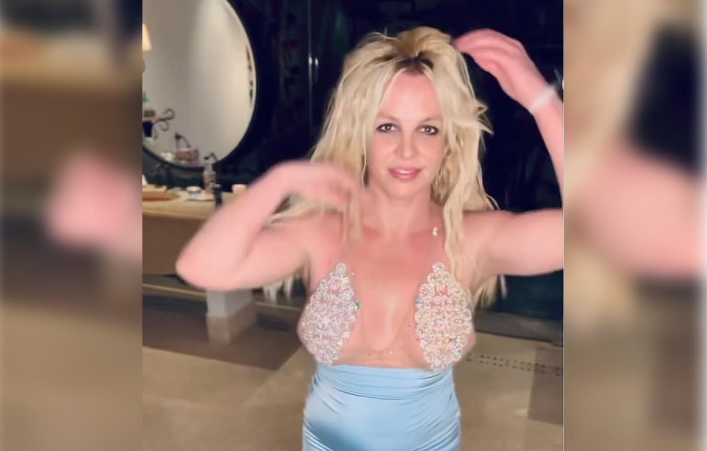 Britney Spears' side boob pops out of her tight minidress as pop star shows  off raunchy dance moves in NSFW new video