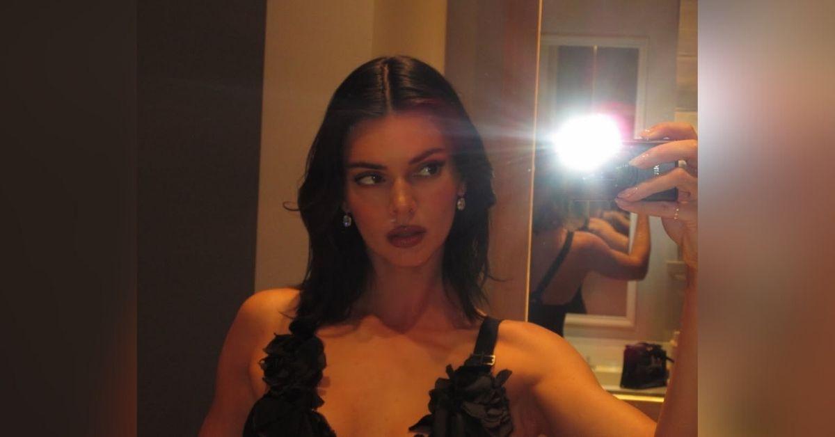 image of The reality star wore a low-cut black top with ruffled straps.