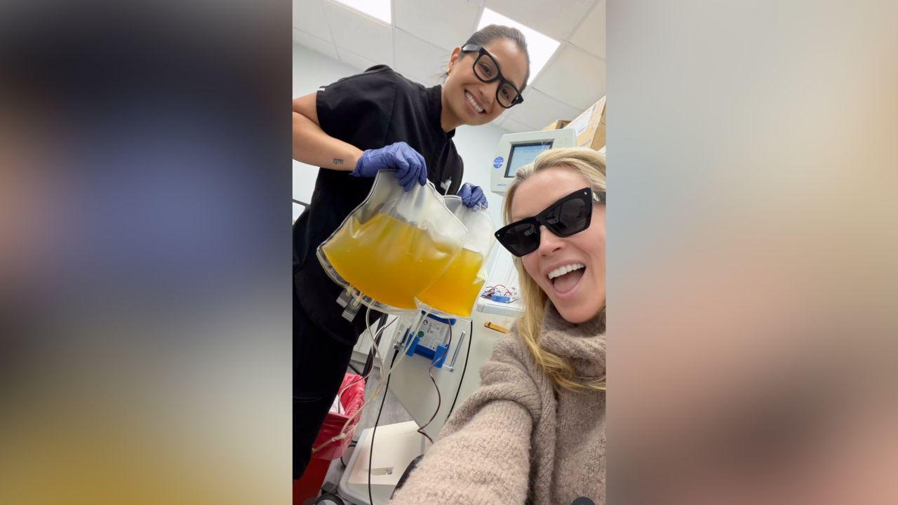 Image of The actress posed alongside a healthcare worker holding bags of yellow-colored fluid during her latest treatment.