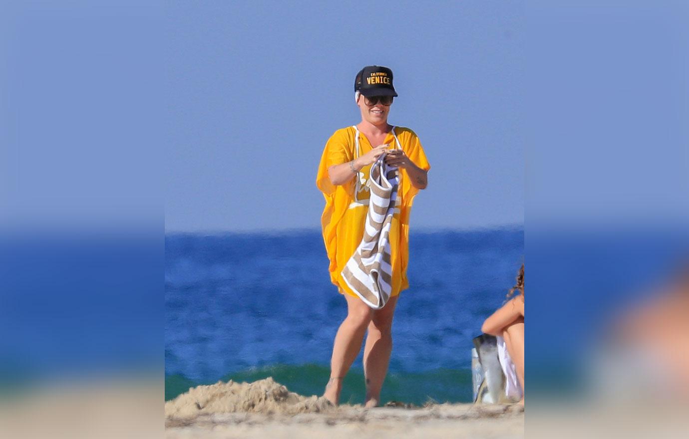 EXCLUSIVE: Pink on the beach in Byron Bay, after postponing her first Sydney show due to illness