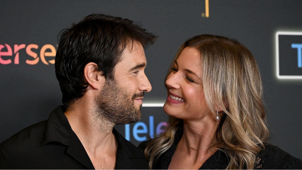 image of The pair stunned in matching black outfits on the red carpet.