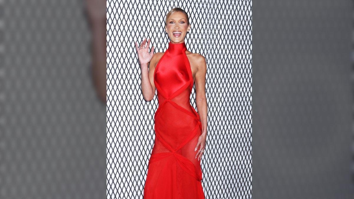 Image of Bella Hadid stunned in a red gown at 'The Beauty' premiere in NYC.
