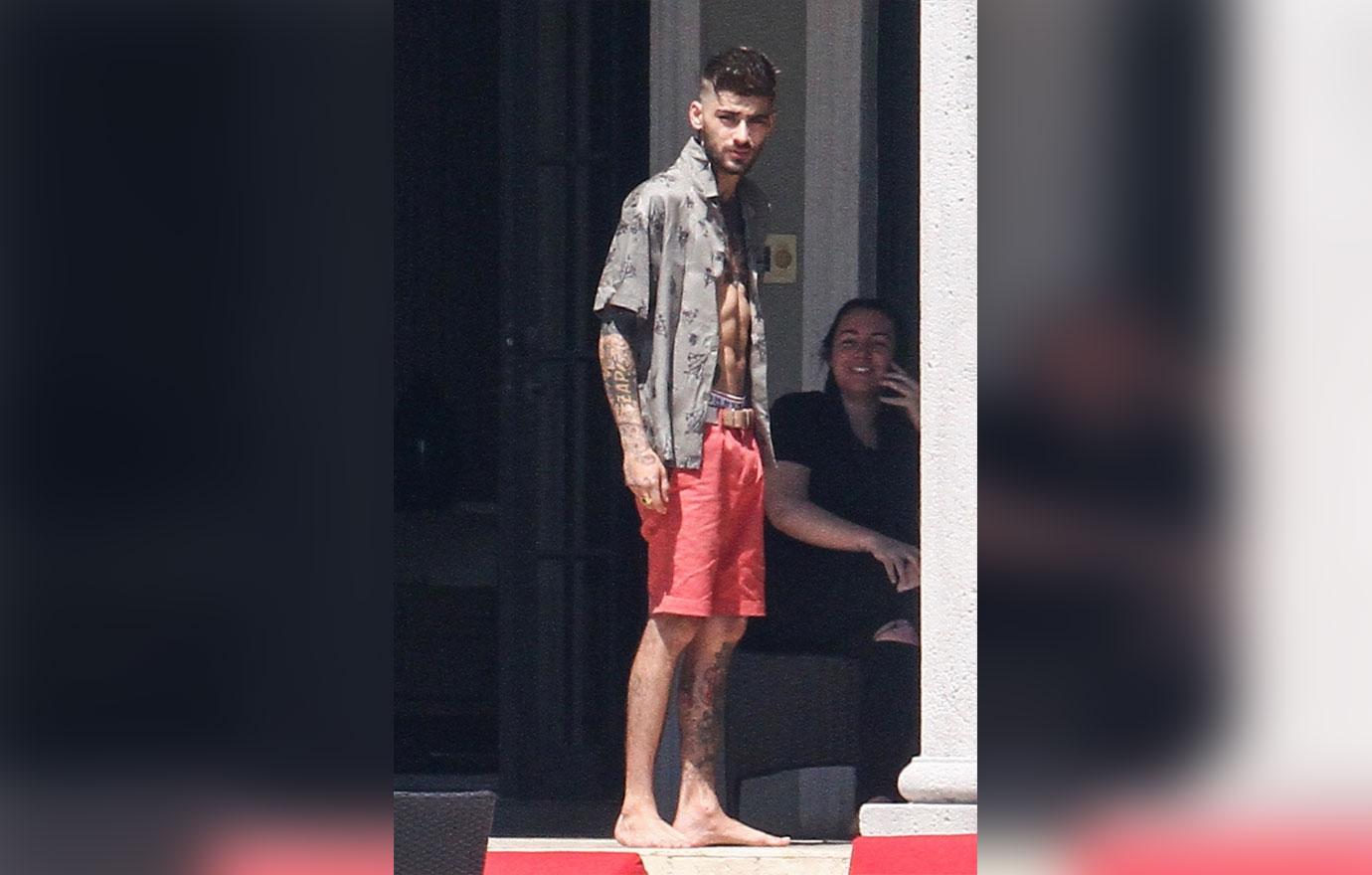 Zayn Malik looks extremely thin as he chain smokes by the pool after split from Gigi Hadid