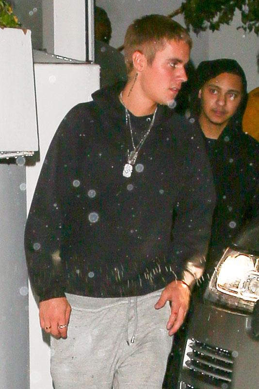 Justin Bieber slips out of Serafina Sunset on a rainy night