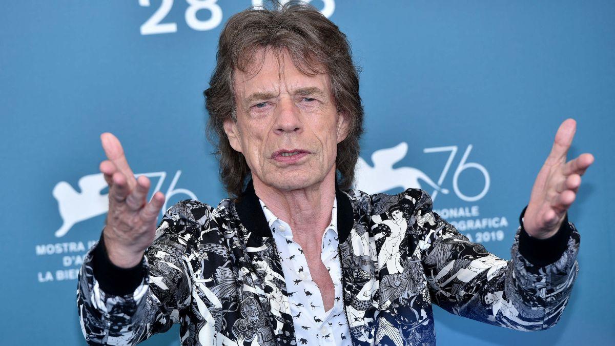 Image of Mick Jagger revealed hearing John Lennon's stories of meeting Elvis Presley put him off the idea.