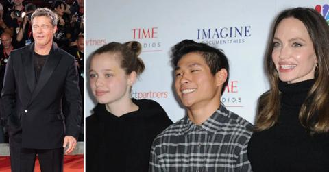 Photo of Brad Pitt and a picture of Angelina Jolie with daughter Shiloh and son Pax.