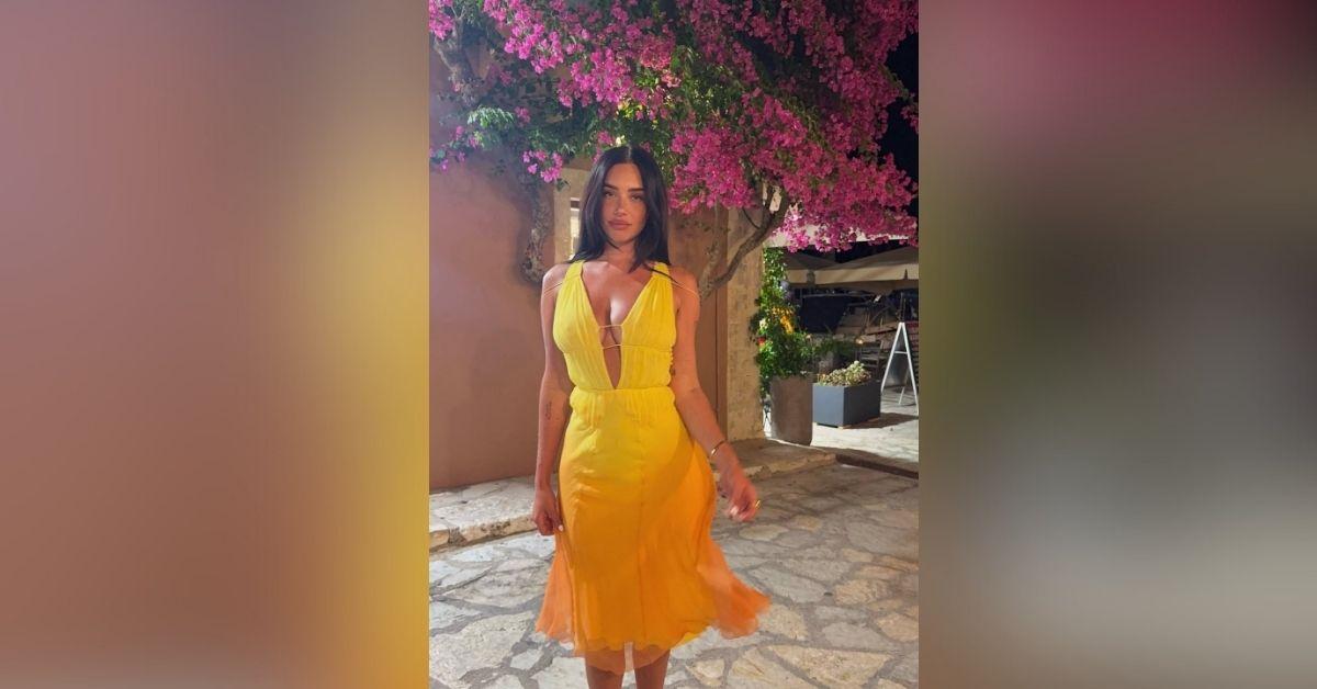 image of Stassie Karanikolaou wore a tight yellow dress during a dreamy European trip.