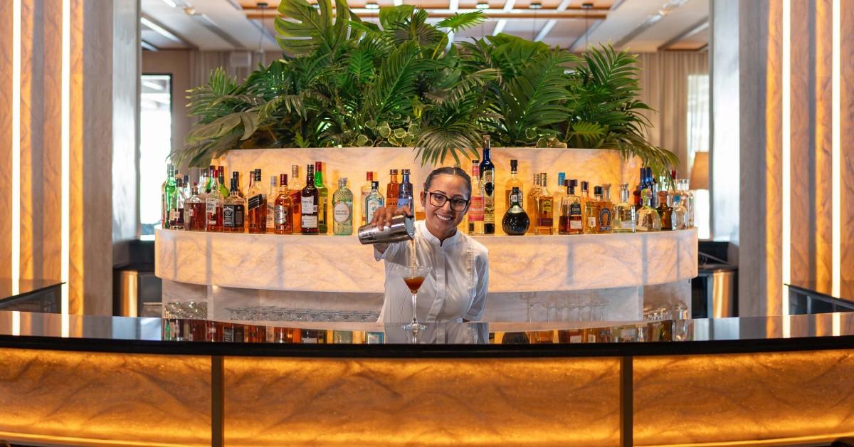excellence coral playa mujeres resort martini bar main lobby bartender