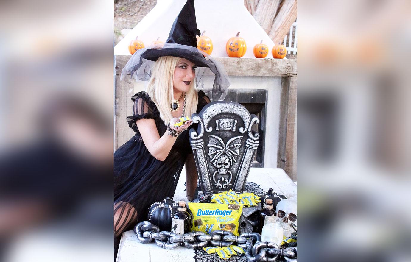 Tori Spelling Dressed as a Witch for Halloween with Butterfinger Candy