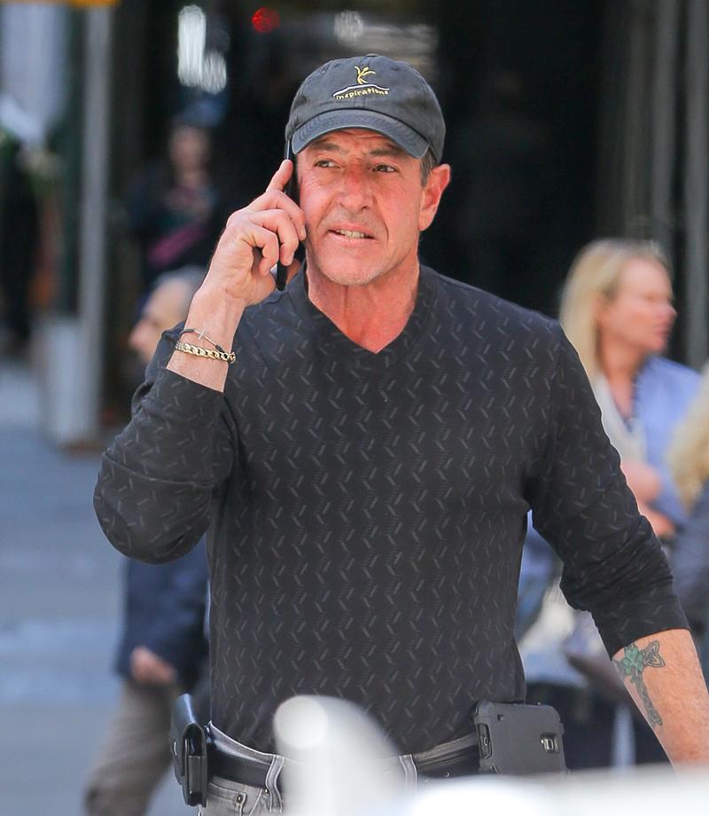 Michael Lohan chats on his cellphone while out and about in Midtown, New York City