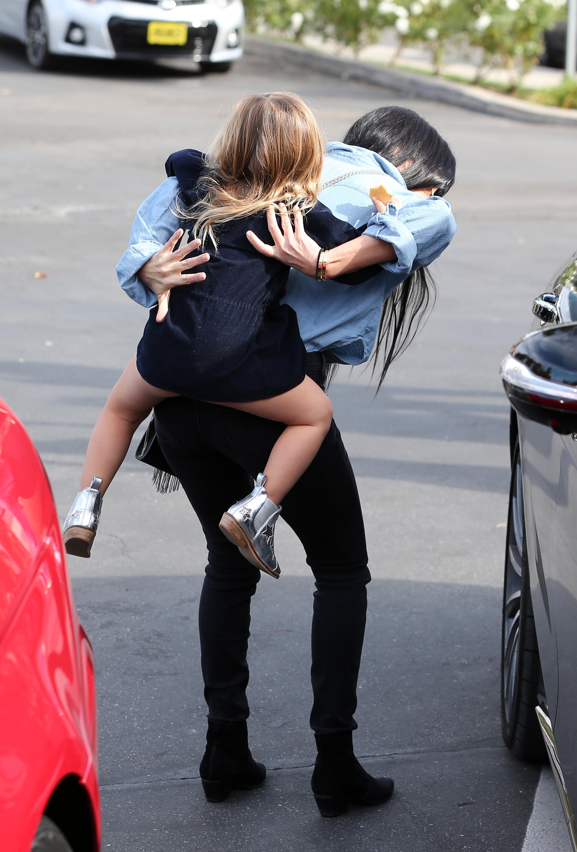 Kourtney Kardashian and Scott Disick leaving with Penelope after having lunch together