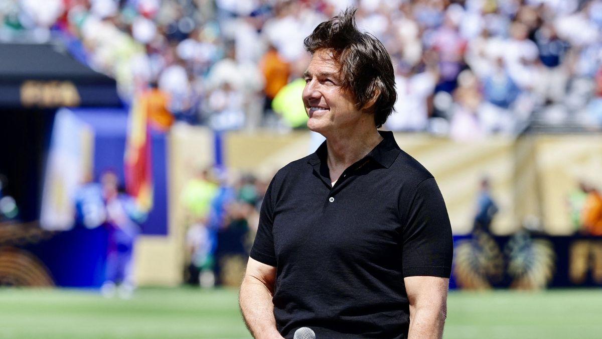 Image of Tom Cruise said football 'turns strangers into friends.'