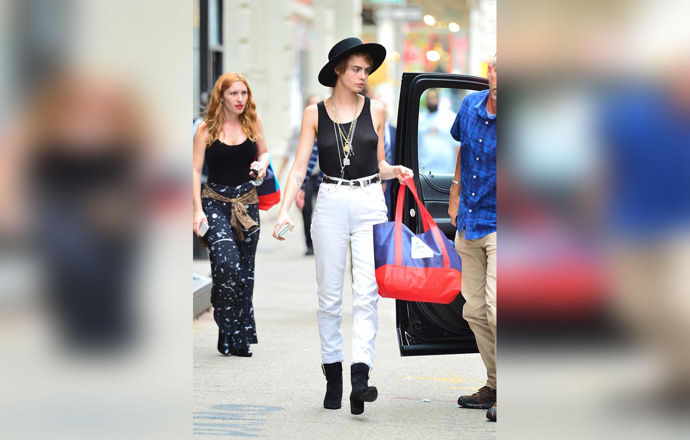 EXCLUSIVE: Cara Delevingne steps out shopping in a revealing tank top in NYC