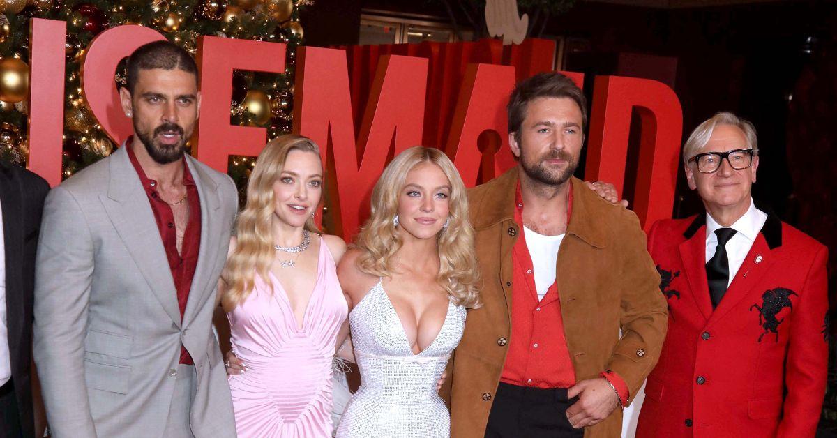 image of The actresses posed with her costars on the red carpet.