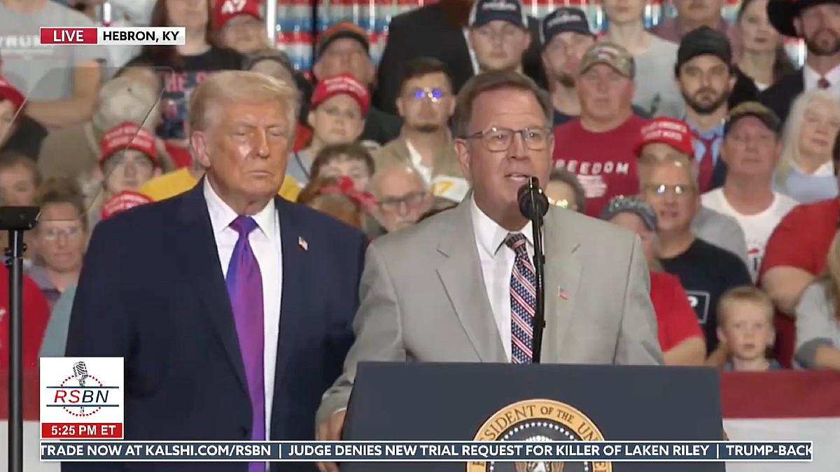 image of Dr. Mehmet Oz helped a woman who fainted during the rally. 