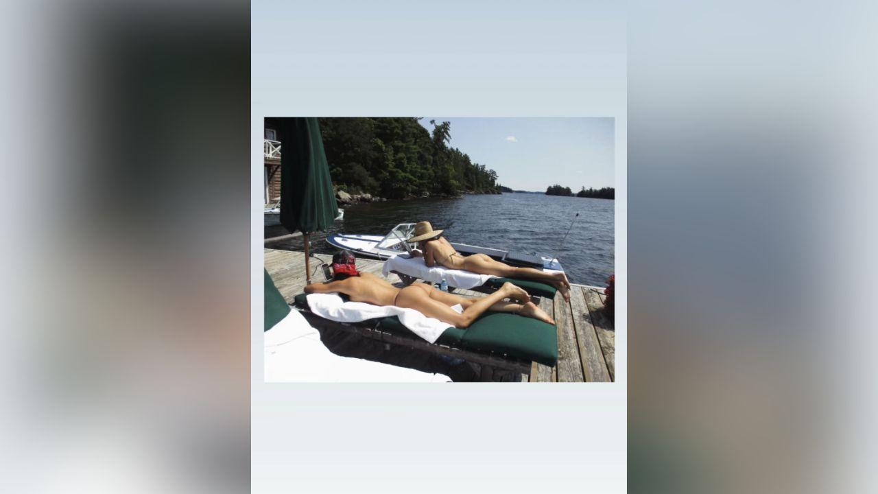 image of Amelia Hamlin shared a vacation photo showing herself relaxing on a lounge chair along a wooden dock.