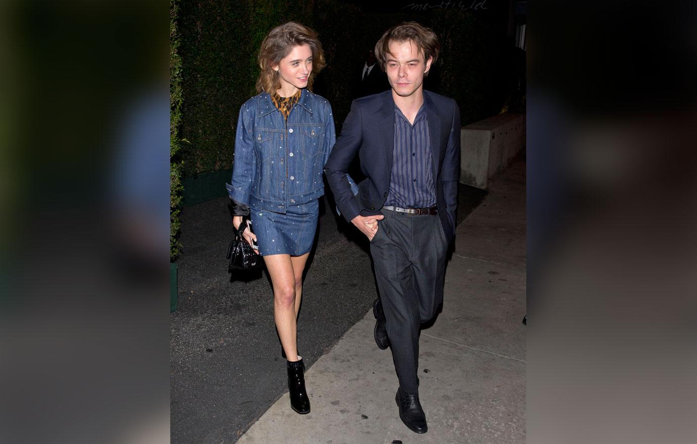 Natalia Dyer and Charlie Heaton hold hands as they leave the &#8216;MIU MIU&#8217; clothing launch in West Hollywood, CA