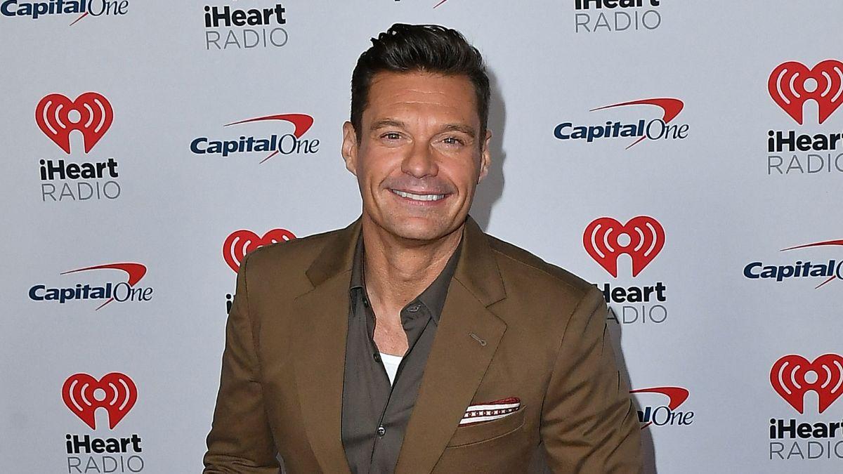 Image of Ryan Seacrest recalled meeting Travis Kelce for the first time after confirming he would attend the couple's wedding.
