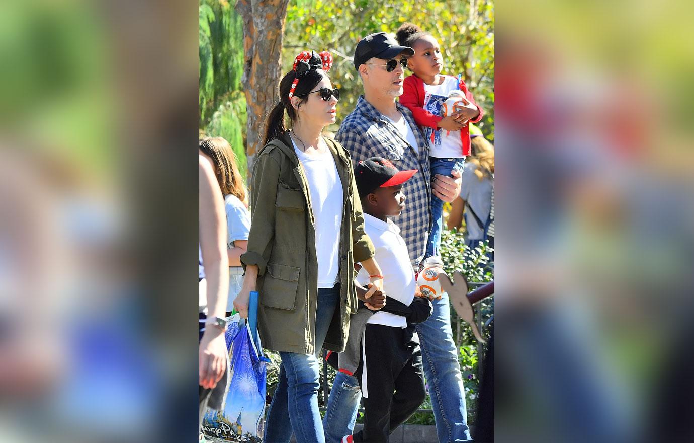 EXCLUSIVE: Sandra Bullock and her boyfriend Bryan Randall are joined by Jason Bateman and his family while spending the day at Disneyland