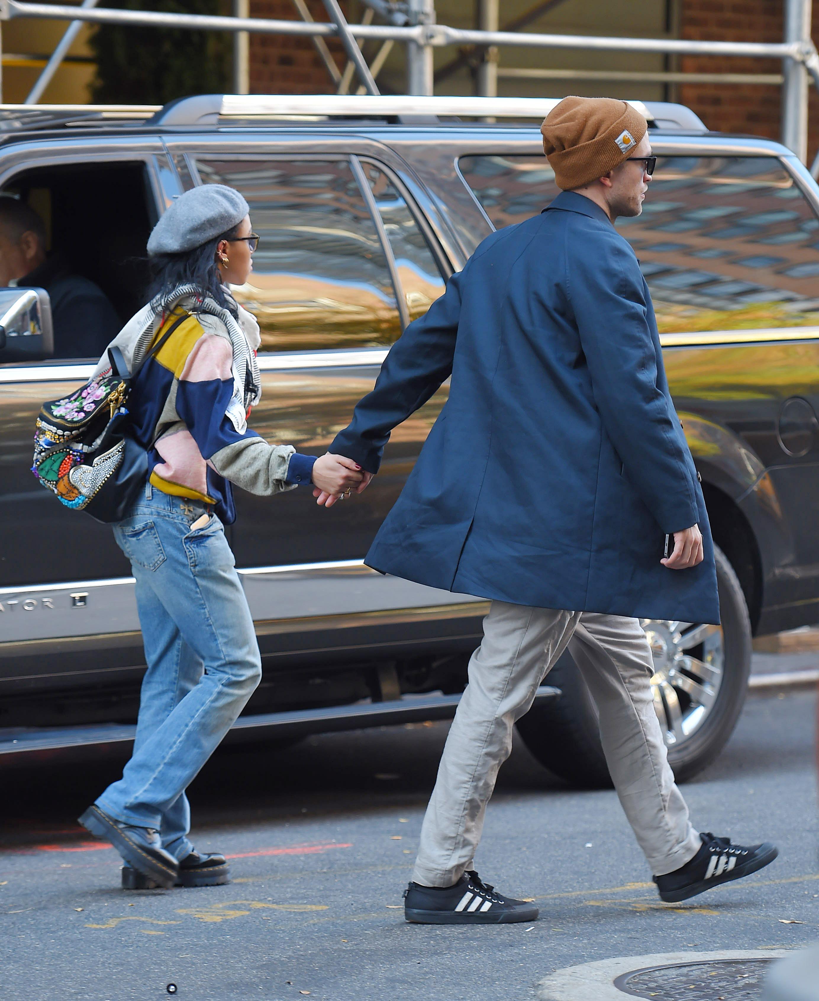 Robert Pattinson and his girlfriend FKA twigs get a taxi cab in Midtown Manhattan