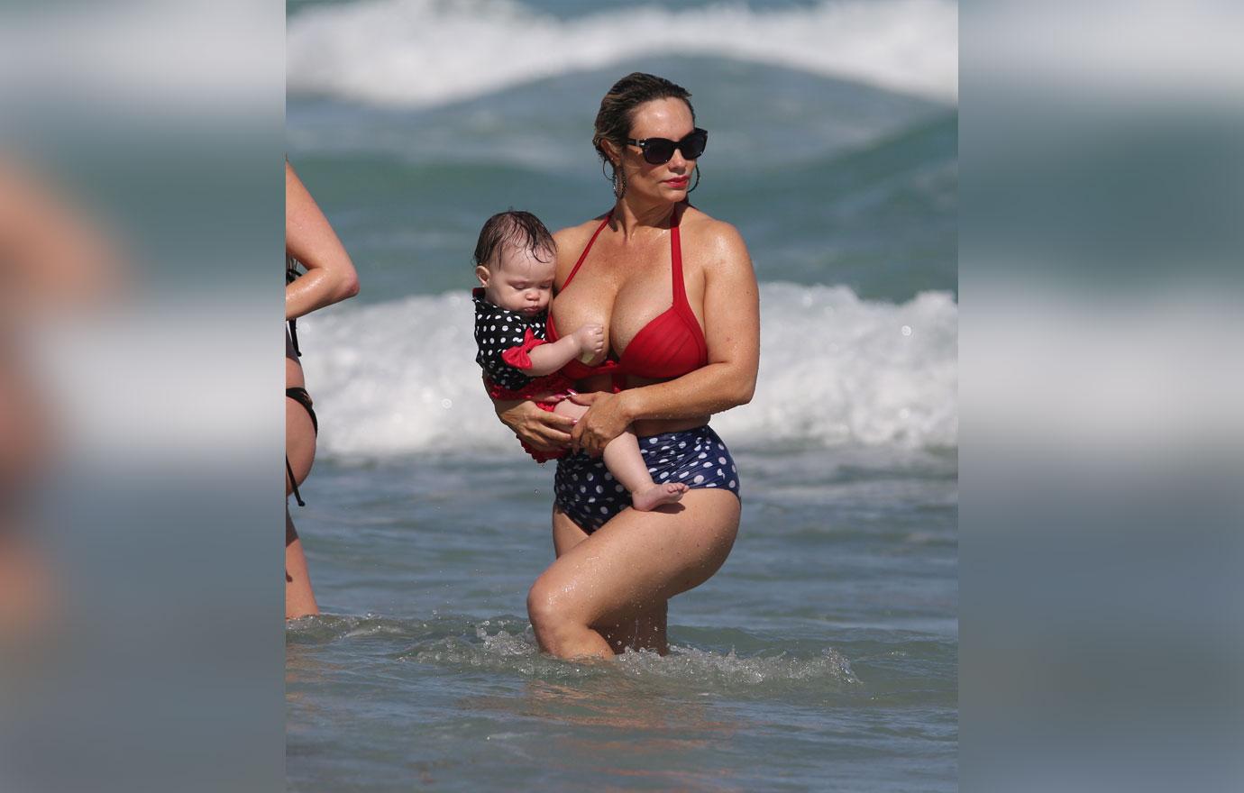 Coco Austin enjoys a day at the beach with her daughter in Miami