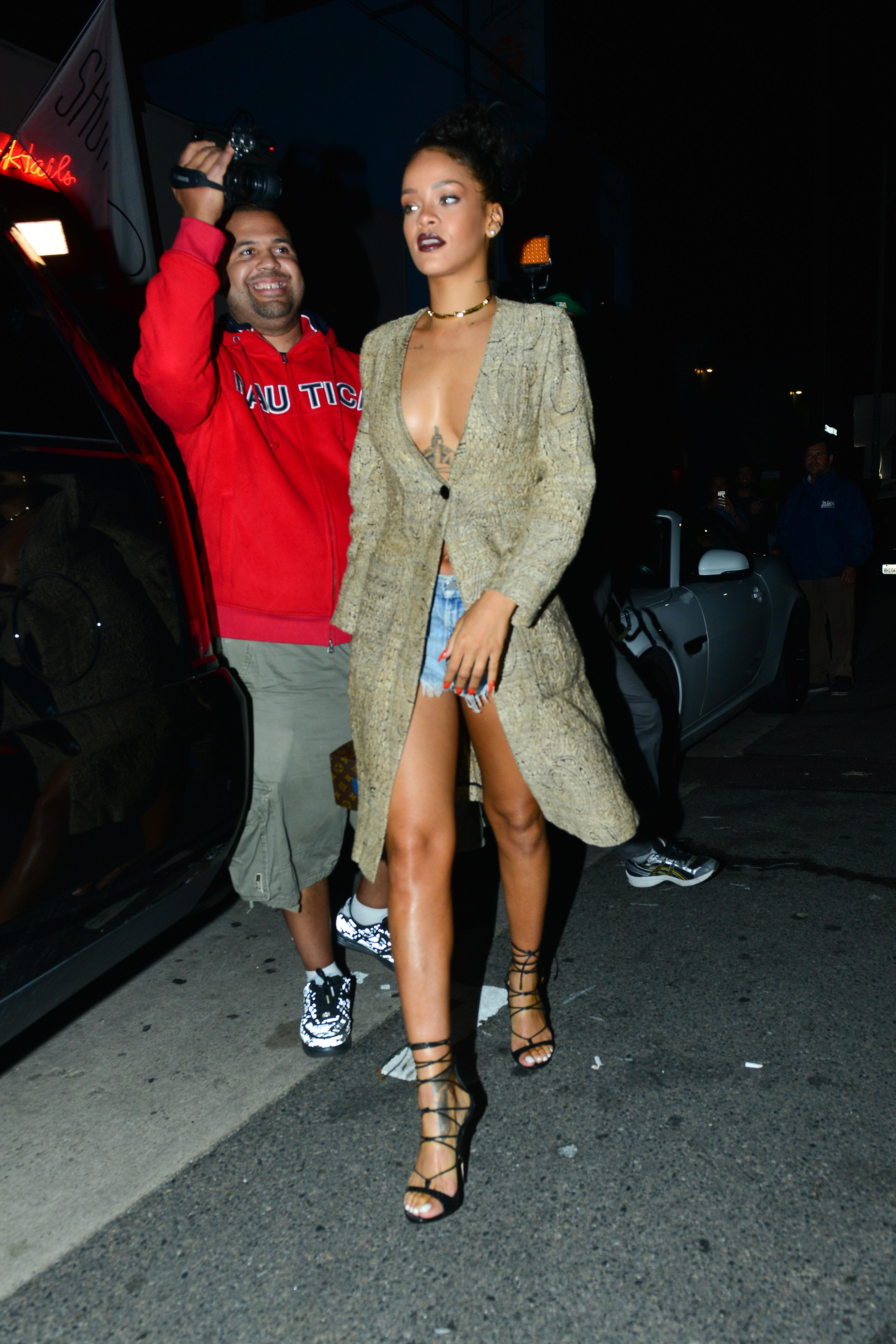 Rihanna Was One Button Away From Wardrobe Malfunction But Covers Up For Home Premiere