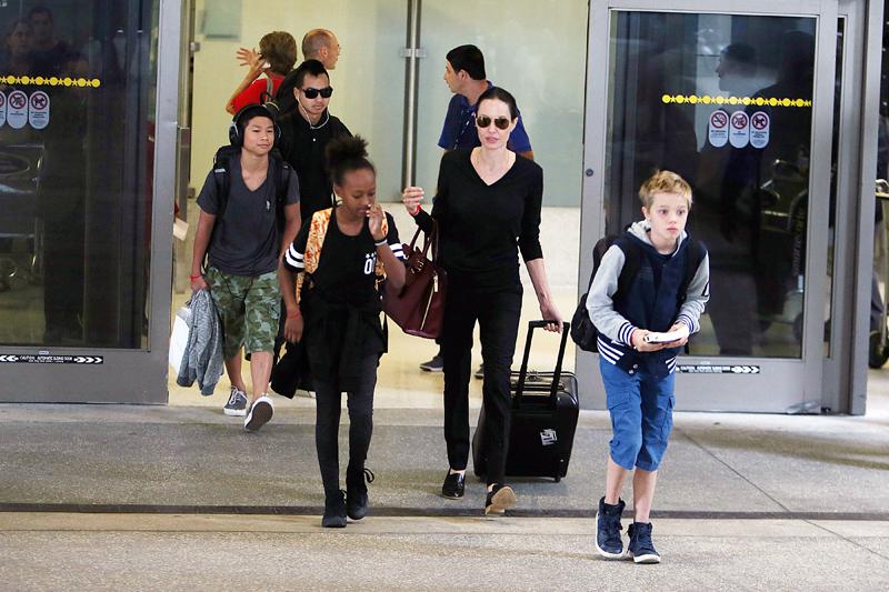 Angelina Jolie and her kids arriving at LAX airport