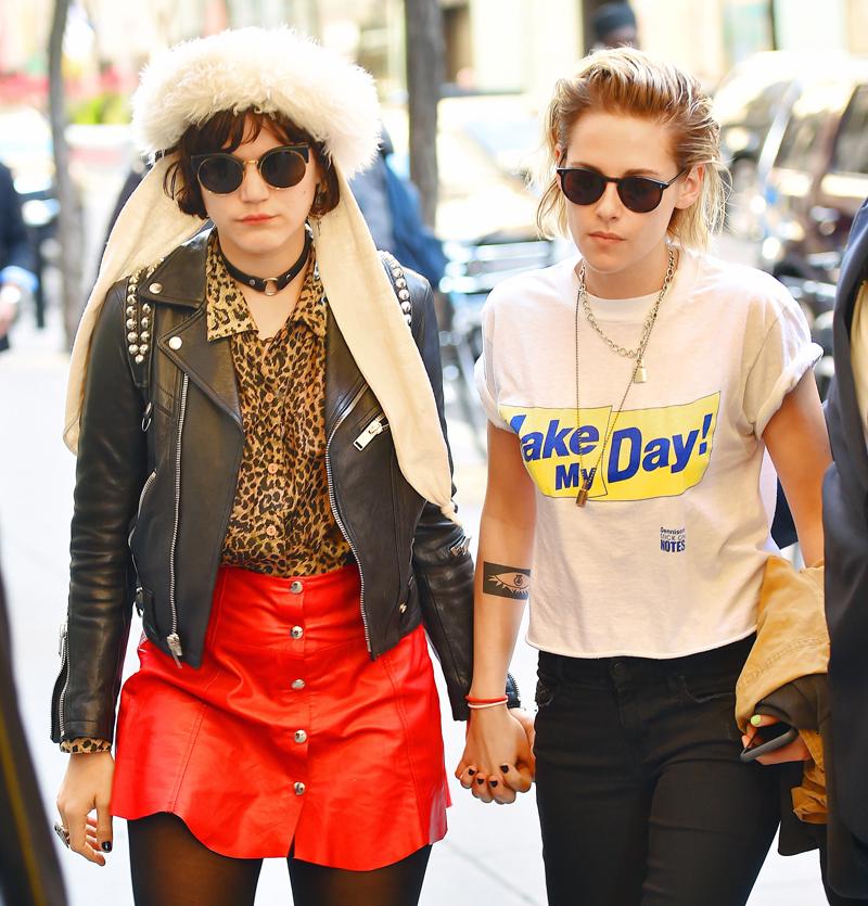 Bleached blonde Kristen Stewart holds hands with girlfriend Soko as they leave their hotel and head to the Rockefeller Center, New York City