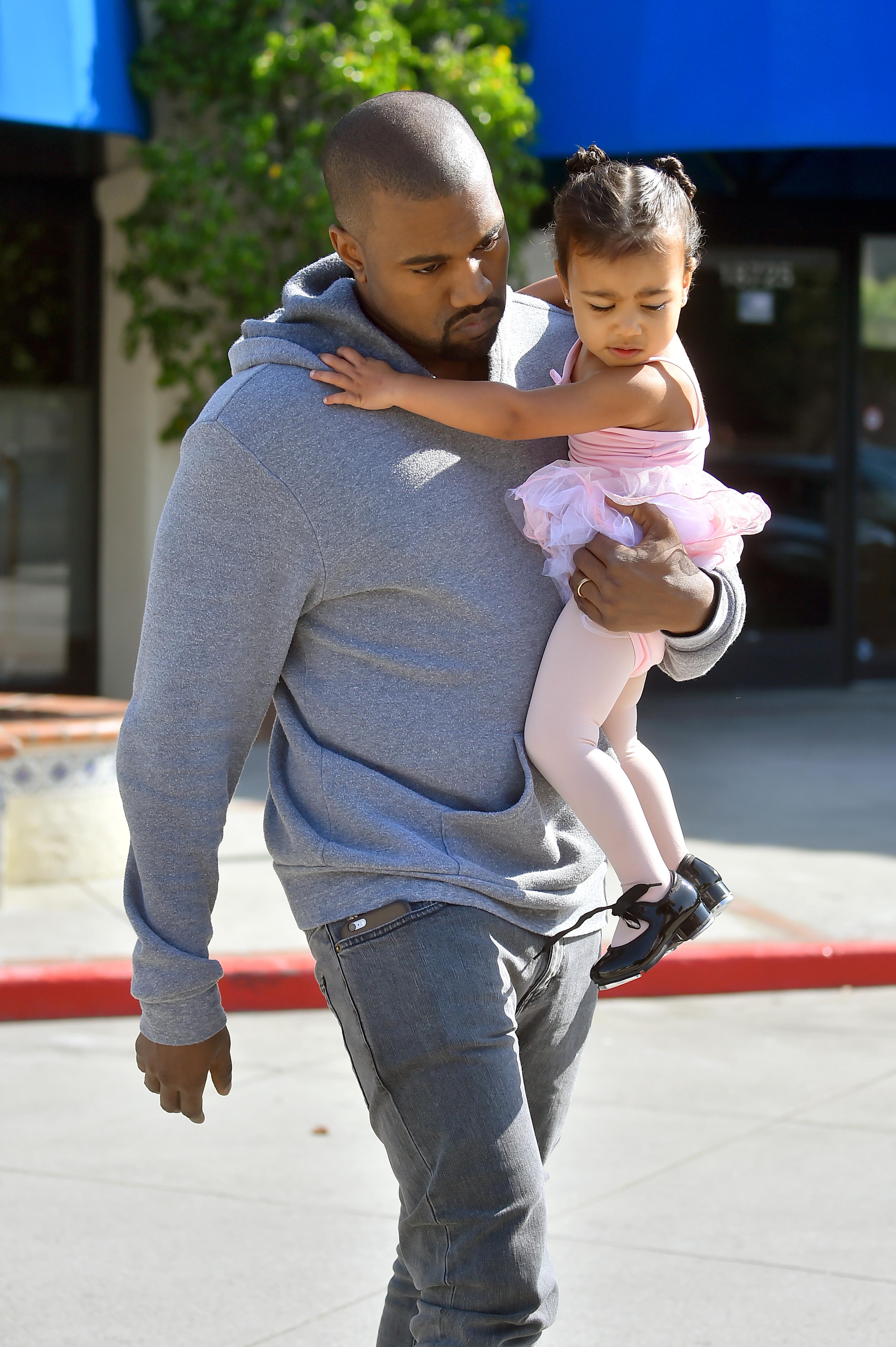 Kim Kardashian and Kourtney Kardashian take their daughters to a dance class in woodland hills