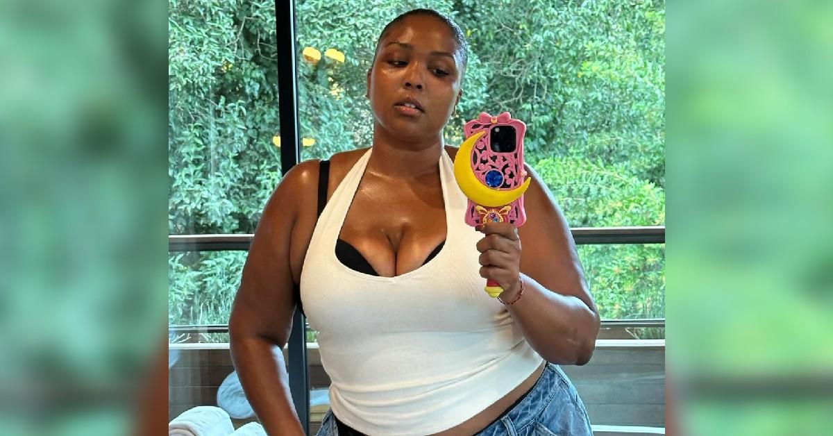 lizzo behind display black bra underwear weight loss journey photo