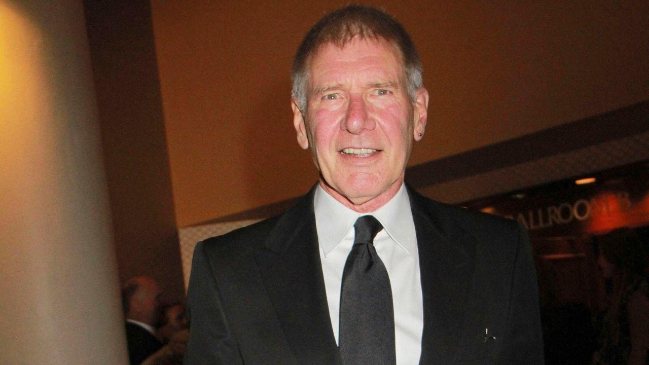 Image of Harrison Ford sported biking gear for the outing, including shorts, a tight-fitting shirt, gloves for better grip on the handlebars, a protective helmet, and sunglasses.