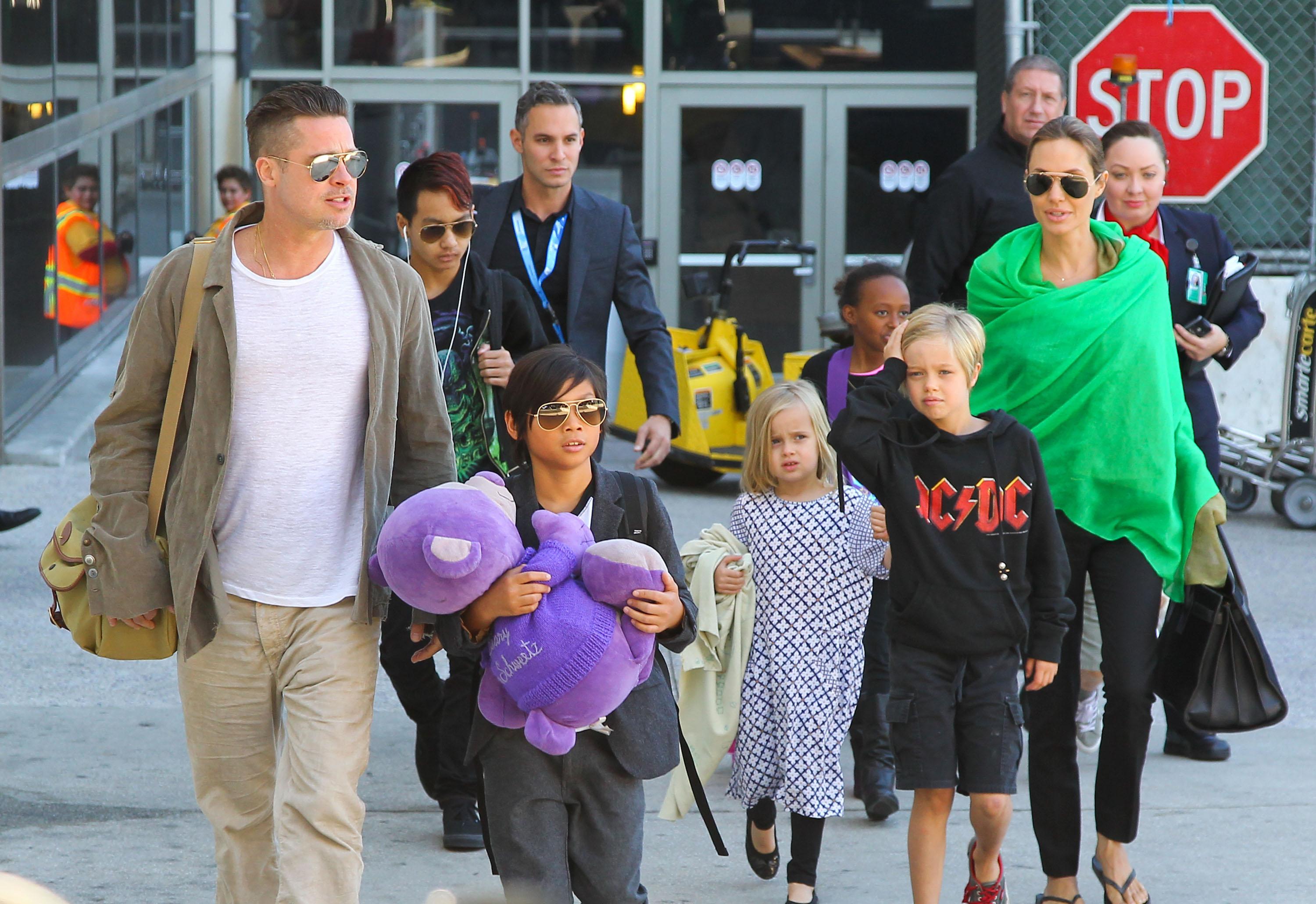 Brad Pitt, Angelina Jolie &amp; The Kids Land At LAX Airport