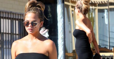 Chrissy teigen black tight dress baby bump 04