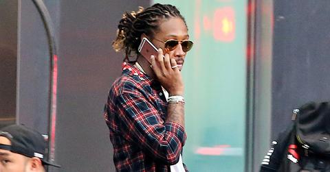 Rapper, Future talks on his iPhone & wears Slippers with Socks as he leaves his hotel in Toronto after OVO Fest