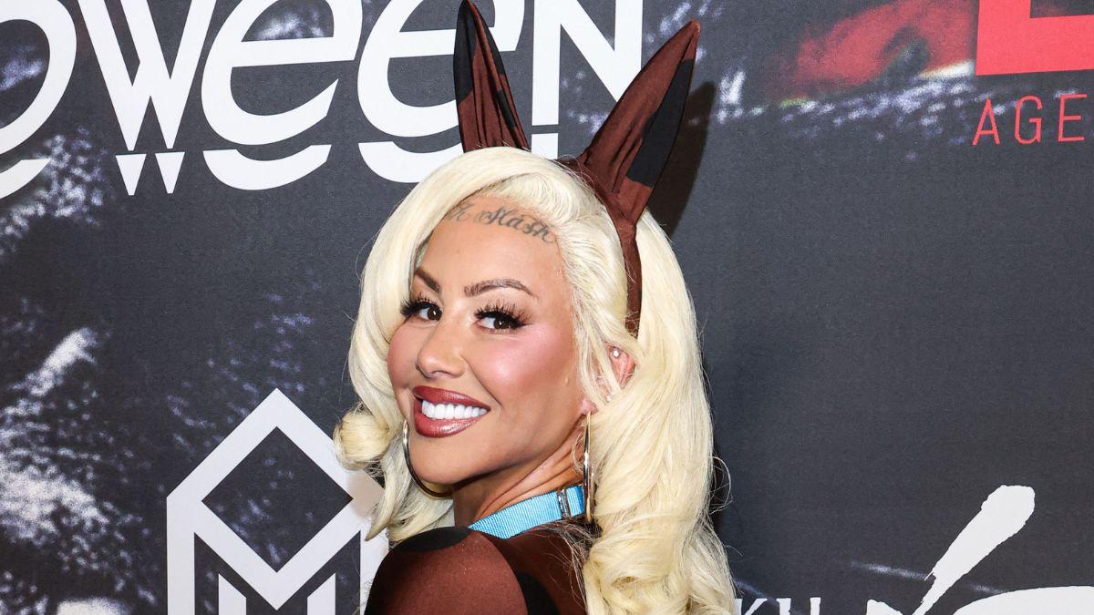 image of She showed off her tattooed arms and signature buzz cut.