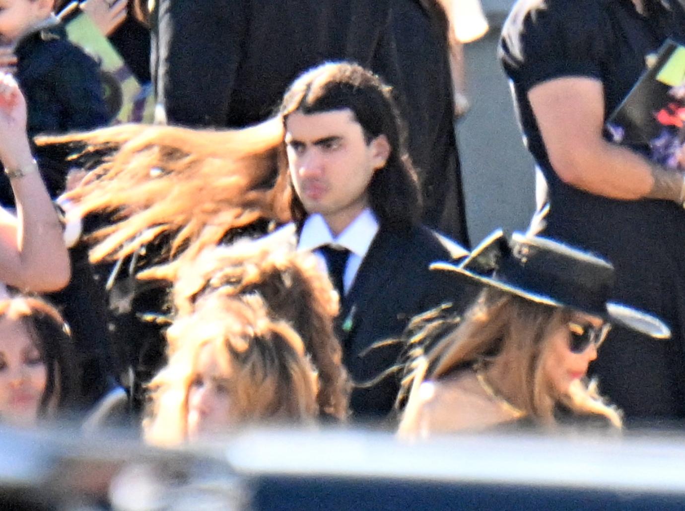 michael jackson children somber uncle tito funeral heart attack photos