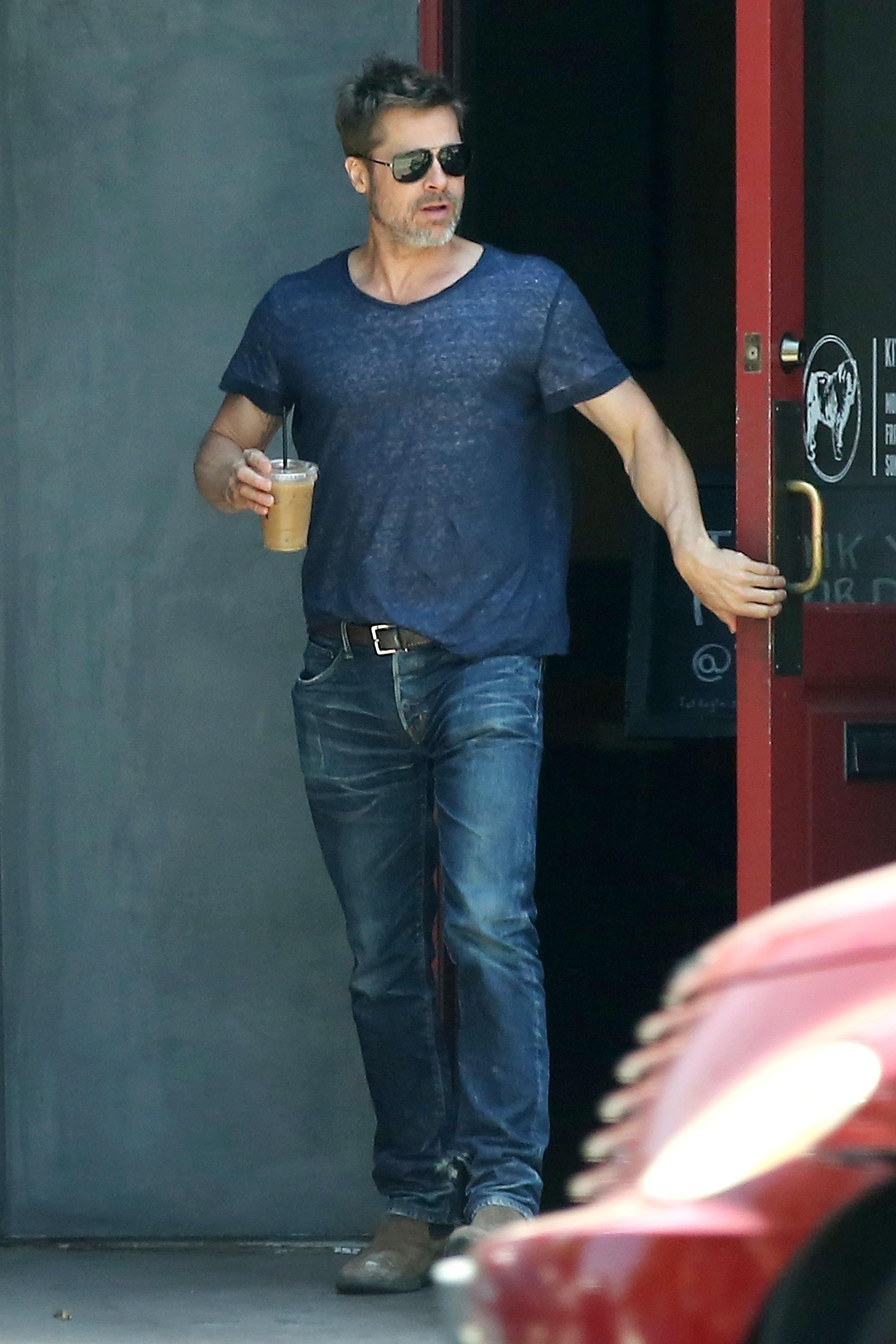 Brad Pitt takes home a iced coffee after lunch