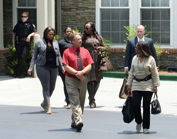 Pat houston tina brown hold hands outside hospice center 04