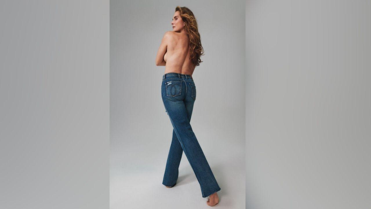 image of Brooke Shields posed topless in a new photo shoot while wearing only high-waisted blue jeans.