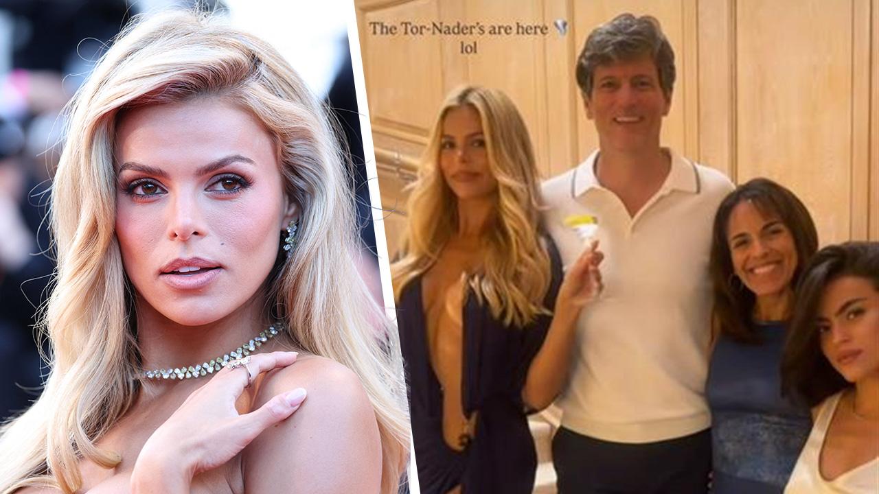 Image of Brooks Nader posed in a risqué dress for a photo with her dad. 