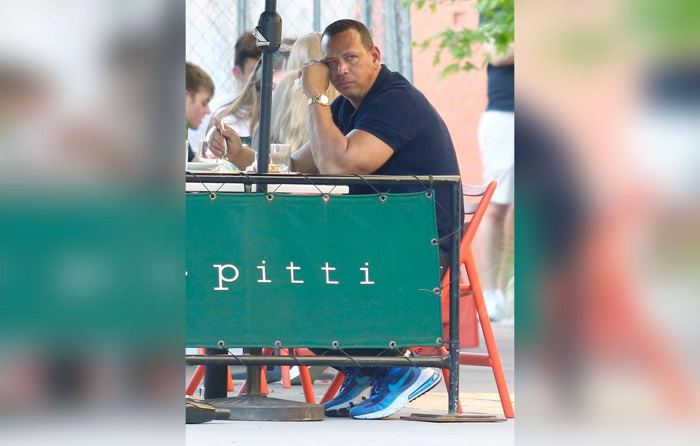 alex rodriguez looks sad as he eats alone in bar pitti