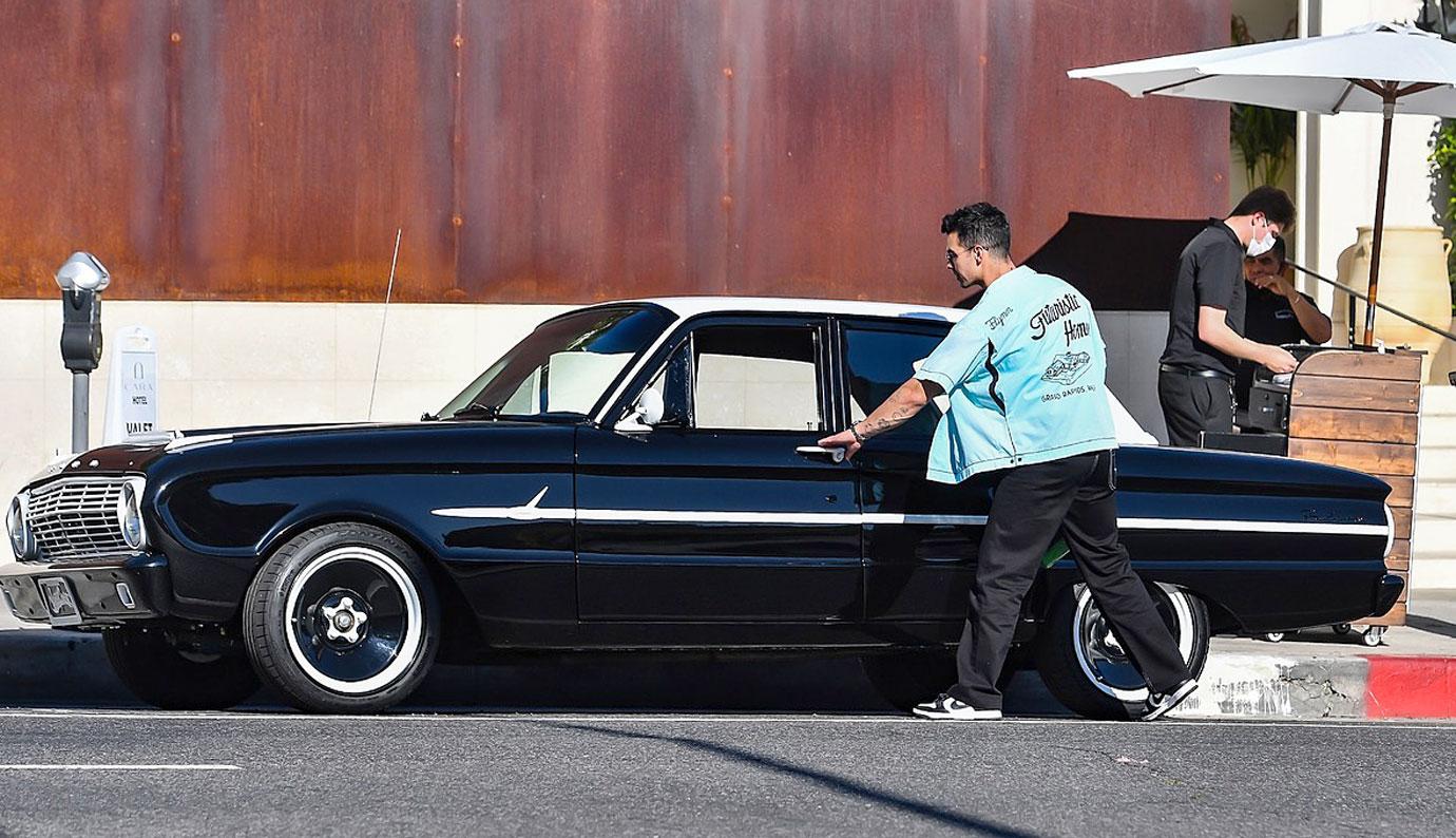 joe jonas drives away in his classic ford falcon