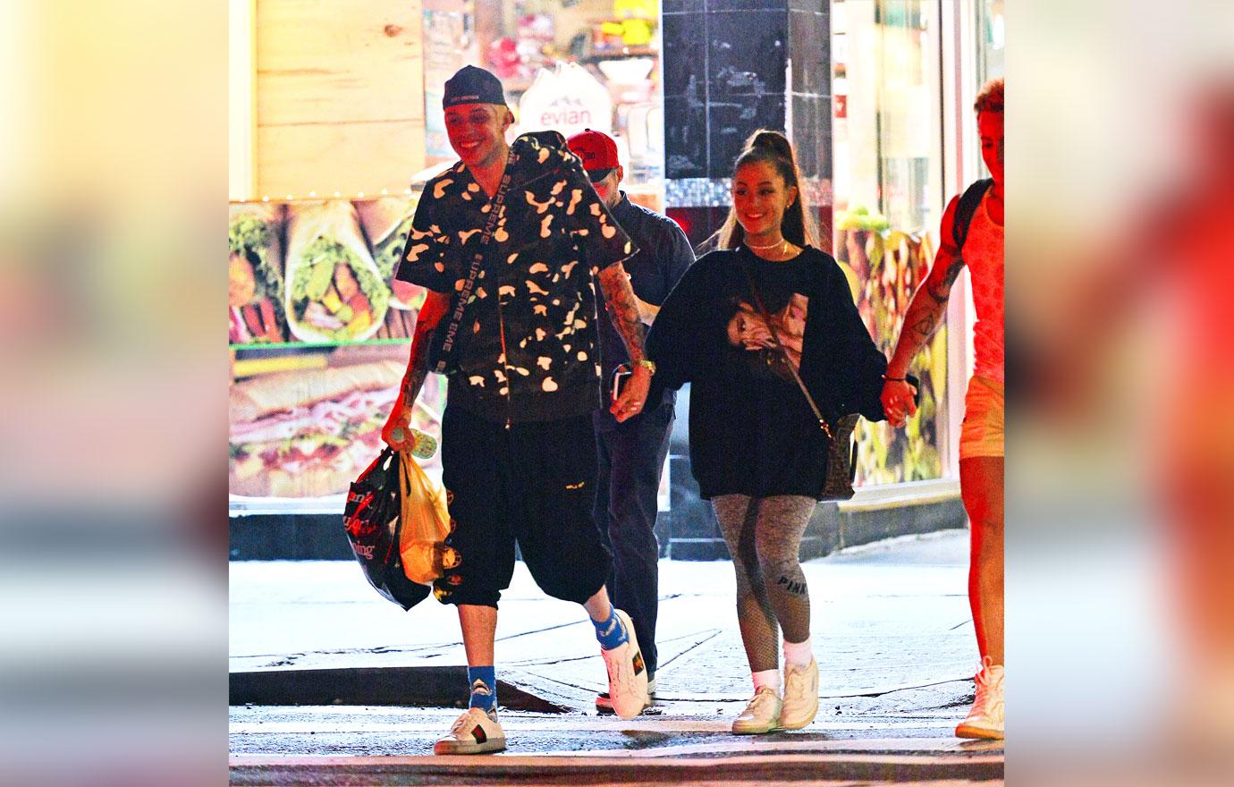 EXCLUSIVE: Ariana Grande and Pete Davidson are all smiles as they step out hand in hand in NYC