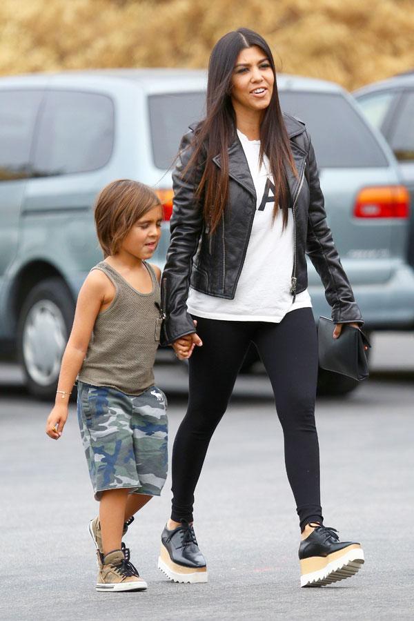 Kourtney Kardashian and little Mason get to work