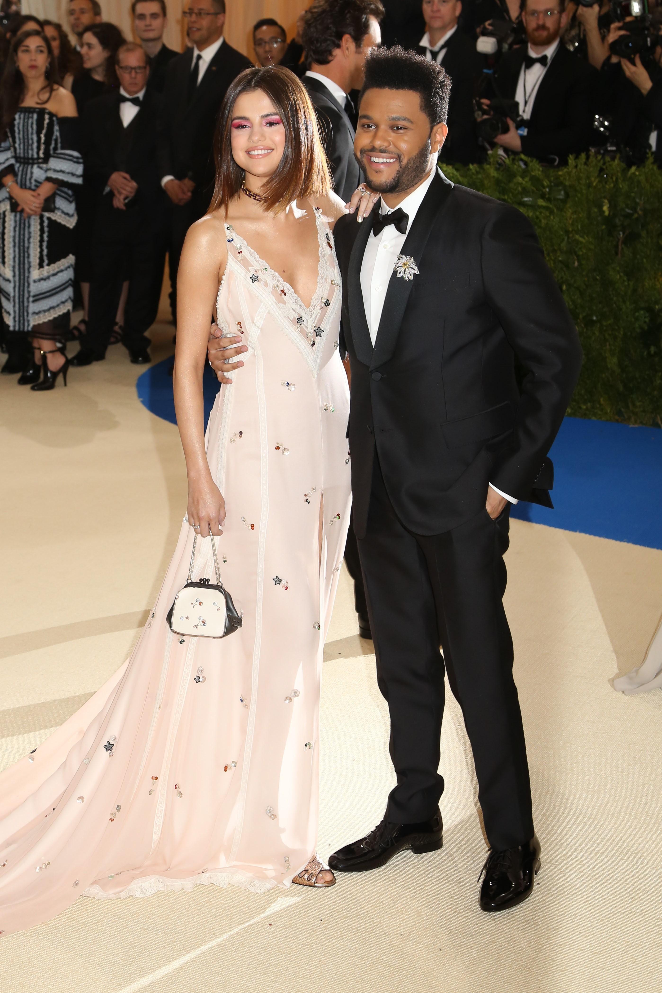 The Weeknd and Selena Gomez share the PDA at Met Gala