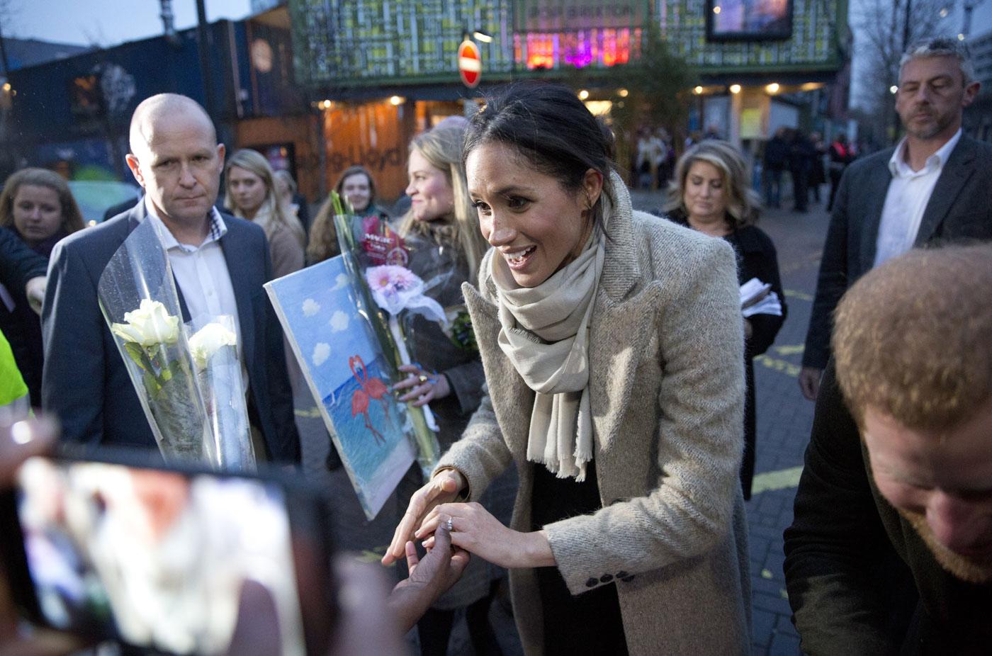 meghan markle pants messy bun prince harry pics 05