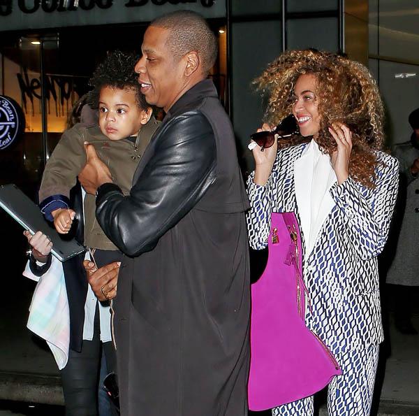 EXCLUSIVE: Jay Z and Beyonce are all smiles as Jay Z carries Blue Ivy while walking out of a building in NYC