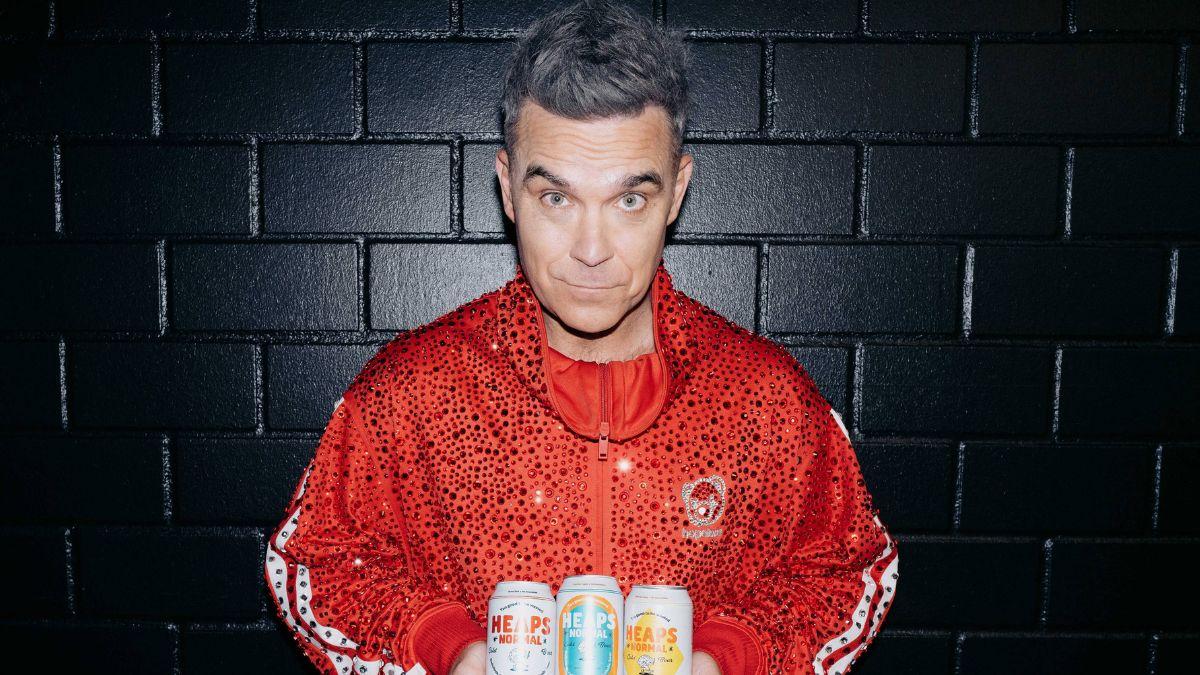 Image of Fans assumed the worst after a small white particle fell onto Robbie Williams' microphone.