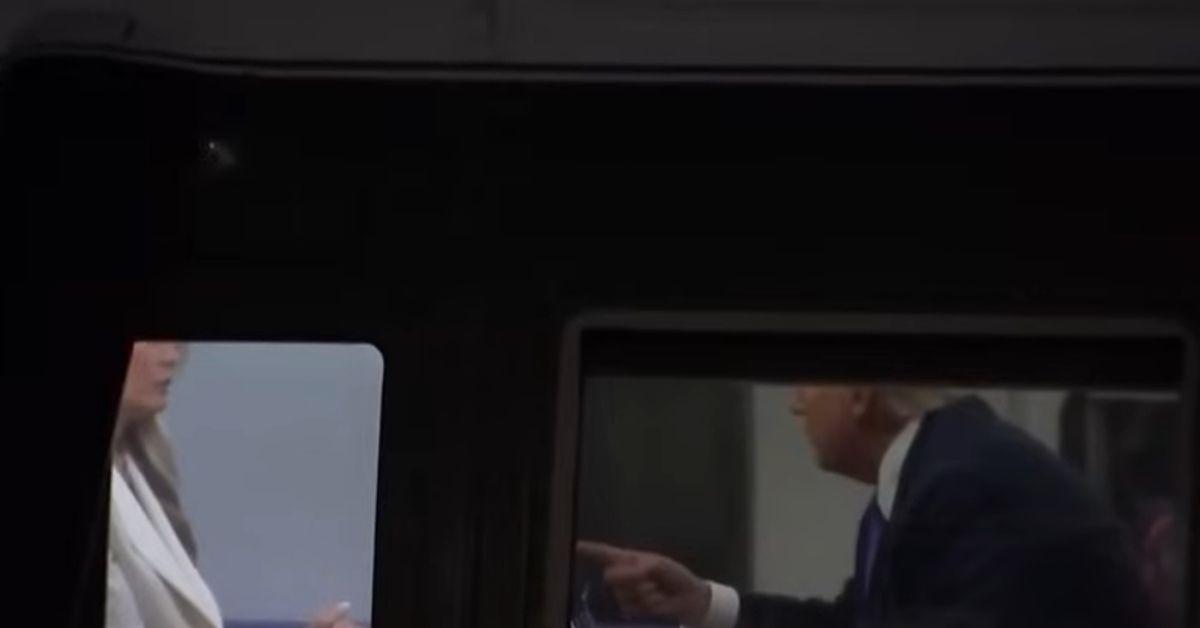 image of Donald and Melania Trump were caught in a tense-looking exchange.