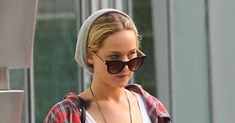 INF – Jennifer Lawrence in a beanie and plaid is seen texting